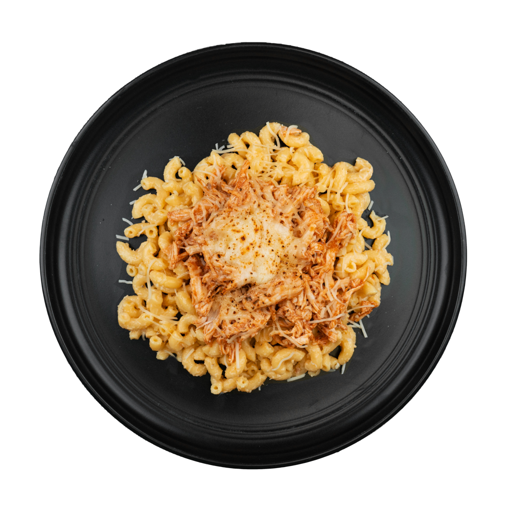 Jessica's Fajita Chicken Mac & Cheese: Our creamy homemade mac & cheese topped with pulled chicken tossed in enchilada sauce and topped with shredded cheese.