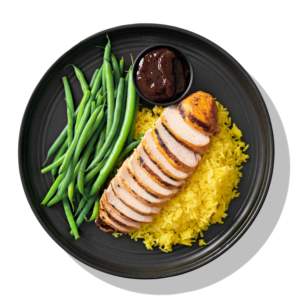 Basics Elite: A simply seasoned, tender grilled chicken breast served over homemade Spanish saffron rice, with a side of steamed green beans and our famous BRO-BQ sauce.