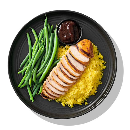 Basics Elite: A simply seasoned, tender grilled chicken breast served over homemade Spanish saffron rice, with a side of steamed green beans and our famous BRO-BQ sauce.
