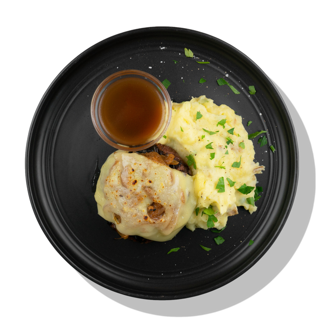 French Onion Burger: A grilled grass-fed beef patty topped with swiss cheese and a caramelized onion and sherry wine sauce served with creamy mashed potatoes.