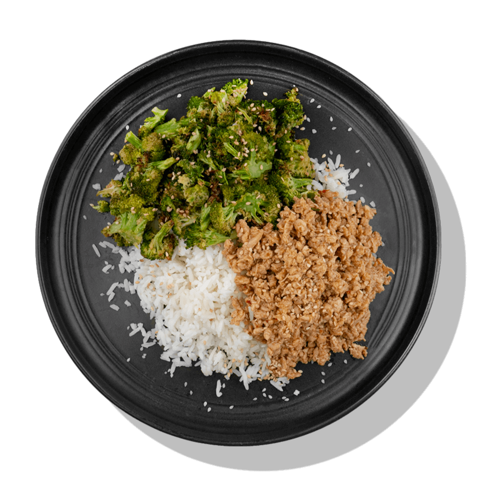 Honey Chili Chicken: Lean ground chicken seasoned with our sweet honey chili sauce served with a side of steamed white rice and roasted broccoli.