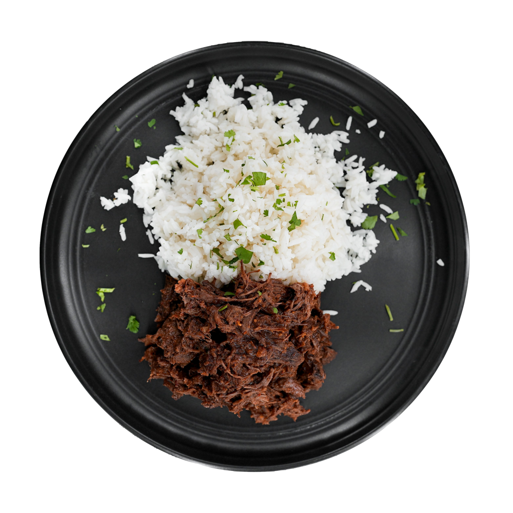 Mexican Shredded Beef: Tender shredded beef tossed in a spicy Mexican-inspired sauce served with a side of steamed white rice.
