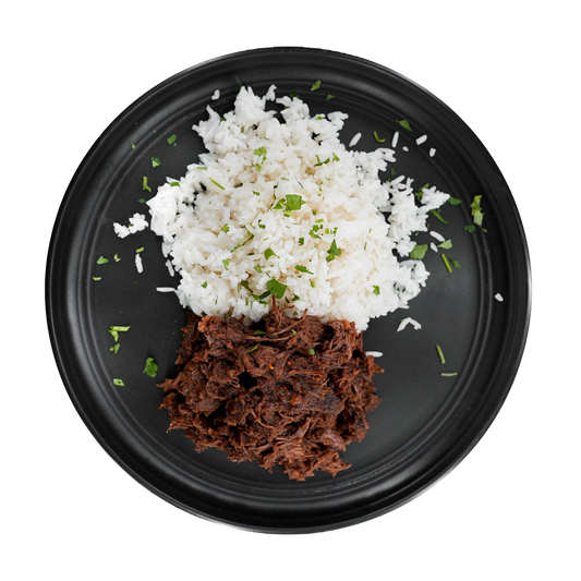 Mexican Shredded Beef: Tender shredded beef tossed in a spicy Mexican-inspired sauce served with a side of steamed white rice.